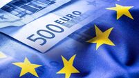 Colorful waving european union flag on a euro money background