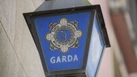 2RBFXDJ Gardai logo outside of Garda station