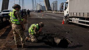 <p>Russia and Ukraine are engaged in a long-range aerial war as their armies remain largely deadlocked on the battlefield, more than four-and-a-half years after Moscow’s all-out invasion of its neighbour. Police officers look at the damages following a Russian drone strike on the Northern Bridge in Kyiv. Picture: Mykola TYMCHENKO / AFP via Getty Images</p>