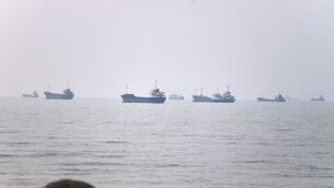 <p>Commercial vessels are seen in the Strait of Hormuz off Bandar Abbas, Iran  (Amirhosein Khorgooi/ISNA via AP)</p>