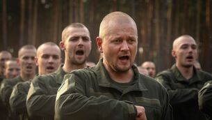 <p>Newly recruited soldiers celebrate the end of their training at a military base close to Kyiv, Ukraine (Efrem Lukatsky/AP)</p>