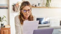 Budget, finance and retirement woman with laptop and paperwork for pension savings, bills or income investment on digital bank a