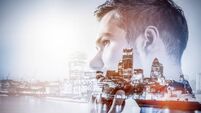 Young businessman thinking. Double exposure city background.