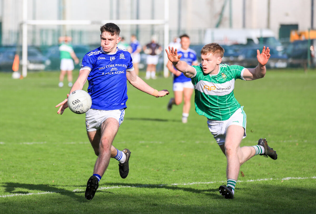 Aghabullogue's Paul Ring tries to block a shot from Naomh Abán's Ed Myers in last year's semi-final. Picture: David Creedon Aghabullogue's Paul Ring tries to block a shot from Naomh Abán's Ed Myers in last year's semi-final. Picture: David Creedon