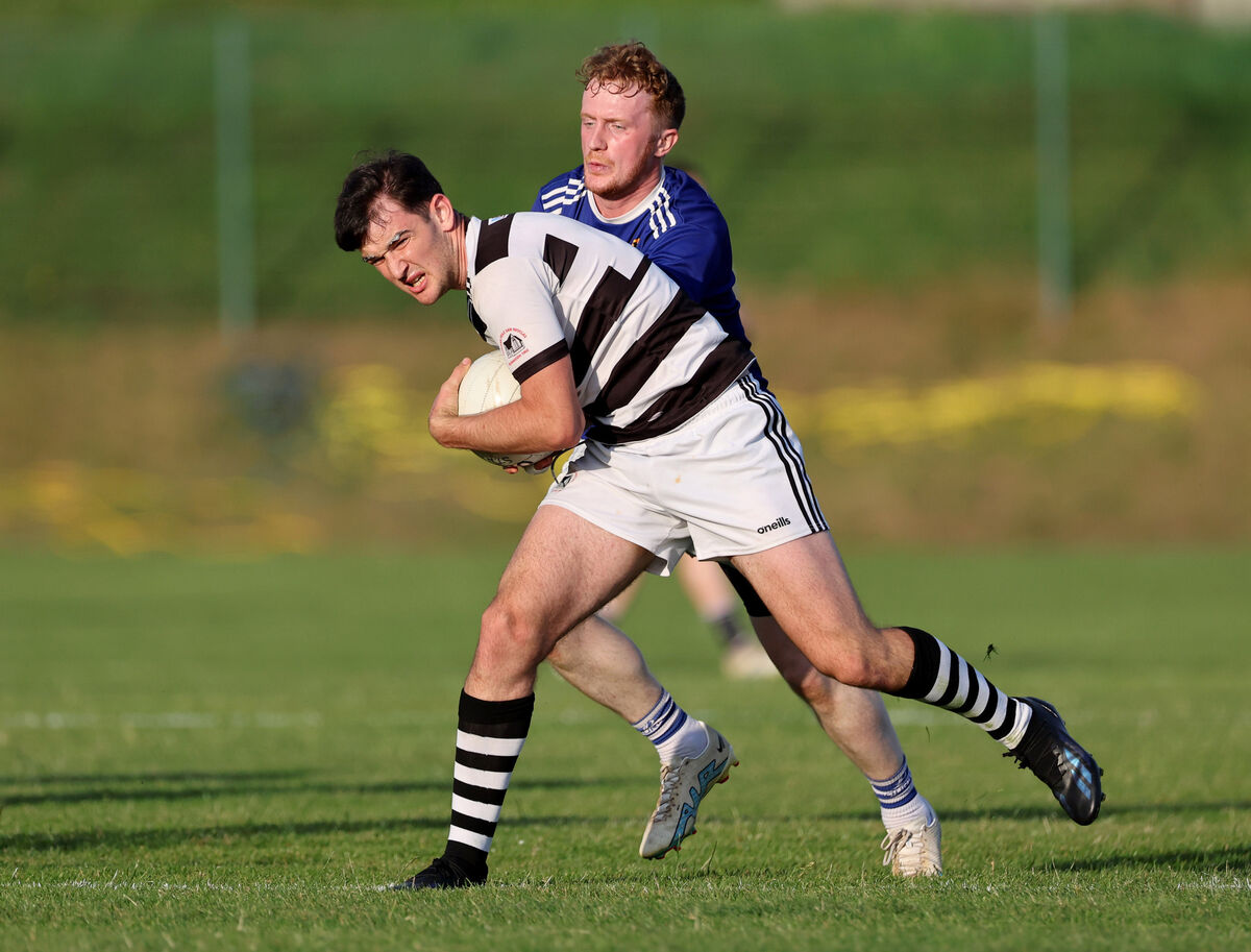 Jake Brosnan, St Nicks, battling John Lynch, Aghinagh. Picture: Jim Coughlan. Jake Brosnan, St Nicks, battling John Lynch, Aghinagh. Picture: Jim Coughlan.