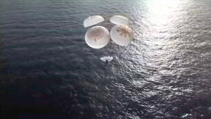 The Dragon capsule splashes down in the Pacific Ocean (SpaceX/NASA via AP)
