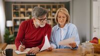 Senior couple planning household budget and finances at home
