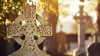 Old stone cross - gravestone in an irish cemetry