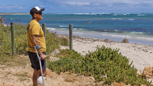 Mel Ismail lost his leg in the attack at Glenfield Beach near Geraldton, Australia (Chris Lewis/Australian Broadcasting Corp via AP)