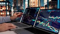 Stockbroker Monitoring Market Trends On Laptop