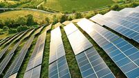 Solar panels fields on the green hills