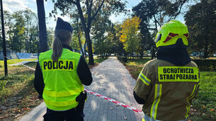 A police officer and a volunteer firefighter near the Vocational School Complex No 4 in Ostroleka, Poland (Rafal Niedzielski/AP) A police officer and a volunteer firefighter near the Vocational School Complex No 4 in Ostroleka, Poland (Rafal Niedzielski/AP)