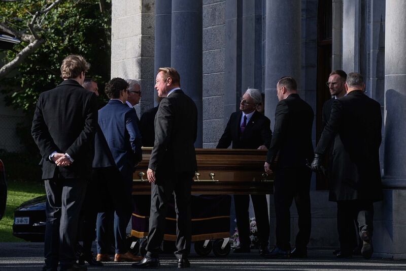 Michael Flatley greets a mourner as the coffin of his wife Niamh O'Brien arrives for her funeral service at the Church Of St. Therese, Mount Merrion, near Dublin. Picture: Mark Marlow/PA Wire