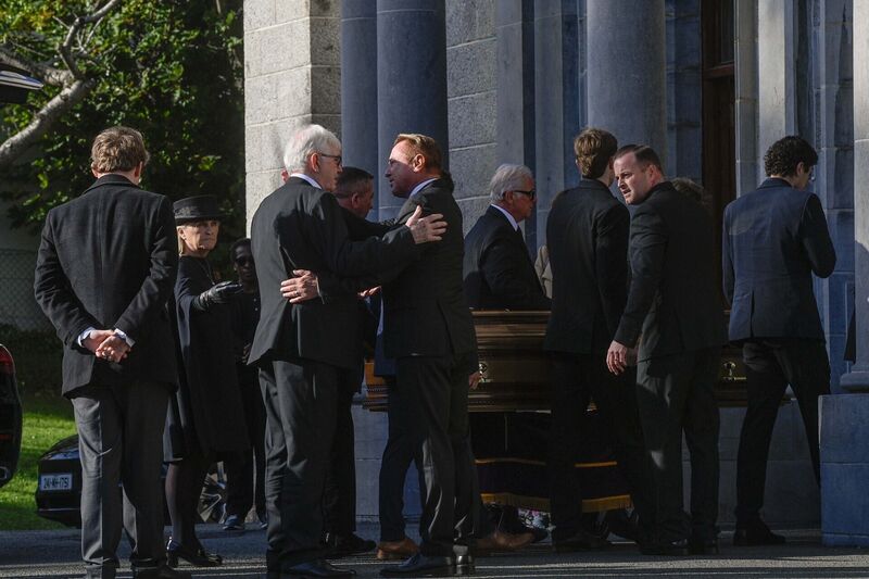 Michael Flatley greets a mourner before the funeral service of his wife Niamh O'Brien at the Church Of St. Therese, Mount Merrion, near Dublin. Picture: Mark Marlow/PA Wire