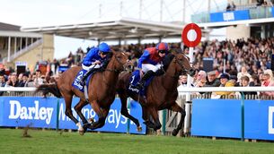 <p>HOME AND HOSED: Darkness Falls, ridden by Ryan Moore, on their way to winning the Darley Dewhurst Stakes at Newmarket Racecourse. Pic: Nigel French/PA Wire</p> <p>HOME AND HOSED: Darkness Falls, ridden by Ryan Moore, on their way to winning the Darley Dewhurst Stakes at Newmarket Racecourse. Pic: Nigel French/PA Wire</p>