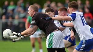 <p>CLOSE QUARTERS: John Hunter and Luke Keating, Kildorrery, battle with Sean Cunningham, Glanworth goalkeeper. Pic: Jim Coughlan.</p>