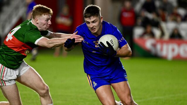 <p>CLOSE CONTEST: Dylan Quinn defends for the Barrs while under pressure at Pairc Ui Chaoimh. Pic: Larry Cummins</p>