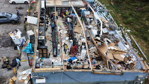 A shop had the roof torn off as Hurricane Isaias hit Milton, Florida (Gerald Herbert/AP) A shop had the roof torn off as Hurricane Isaias hit Milton, Florida (Gerald Herbert/AP)