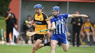 <p>Oisín Finneran, pictured here being tackled by Micheál Byrne, scored a famous late winner for Four Roads.</p> <p>Oisín Finneran, pictured here being tackled by Micheál Byrne, scored a famous late winner for Four Roads.</p>