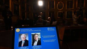 <p>Portraits of US economists Robert E. Hall and Michael Woodford are seen at the Royal Swedish Academy of Sciences in Stockholm on Oct. 12. Photographer: Jonathan Nackstrand/AFP/Getty Images</p> <p>Portraits of US economists Robert E. Hall and Michael Woodford are seen at the Royal Swedish Academy of Sciences in Stockholm on Oct. 12. Photographer: Jonathan Nackstrand/AFP/Getty Images</p>