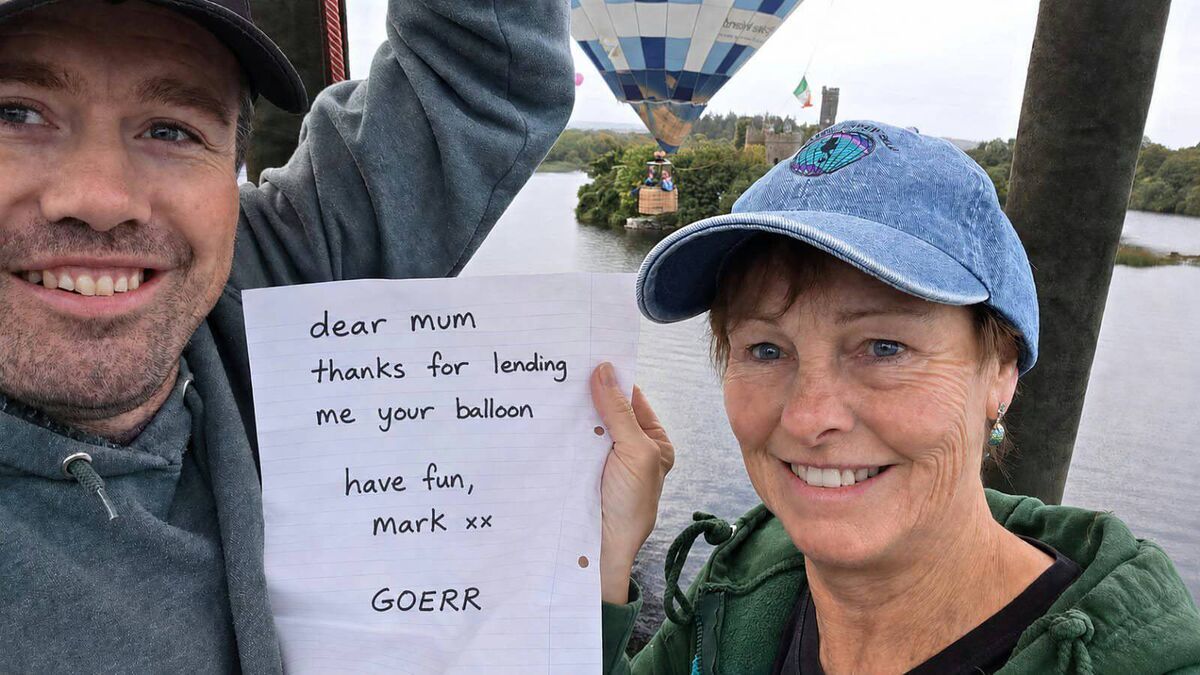 Mark O'Neill after delivering a letter to his mother Carol (right). He had been tasked with the challenge while competing in a hot air balloon event. Mark O'Neill after delivering a letter to his mother Carol (right). He had been tasked with the challenge while competing in a hot air balloon event.
