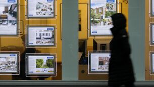<p>A pedestrian walks past an estate agents window.  House prices in Ireland increased by 5.1% in the year to August, continuing their upward push but with the pace of increase slowing slightly. Picture: PA</p>