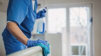 Nurse cleaning hospital ward