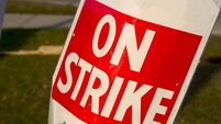 On a Strike sign in red and white poster