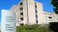 Family of woman, 60, who died after going to hospital with abdominal pain settle action