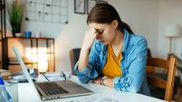 Unemployed woman expressing negative emotions during recession. Jobless woman looking vacancies online with no success
