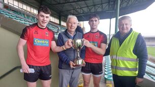<p>Joint St Michael’s Listowel captains Odhran Buckley and Ronan Sheridan receiving the O’Sullivan Cup from Christy Killeen and Weeshie Lynch of Kerry PPS. Pic: Adrienne McLoughlin</p> <p>Joint St Michael’s Listowel captains Odhran Buckley and Ronan Sheridan receiving the O’Sullivan Cup from Christy Killeen and Weeshie Lynch of Kerry PPS. Pic: Adrienne McLoughlin</p>