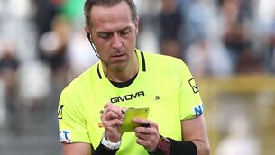 <p>NO MORE ADMIN: Referee Luca Pairetto writes on his yellow card. Will that soon be a thing of the past?. Photo by Marco Luzzani/Getty Images</p>