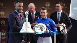 <p>William Buick is presented with his trophy after he rode Ombudsman to win the Qatar Racing Champion Stakes (Group 1) at Ascot Racecourse, Berkshire. Photo: Jonathan Brady/the Press Association.</p> <p>William Buick is presented with his trophy after he rode Ombudsman to win the Qatar Racing Champion Stakes (Group 1) at Ascot Racecourse, Berkshire. Photo: Jonathan Brady/the Press Association.</p>