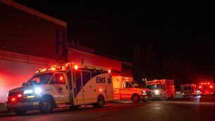 Emergency crews and military personnel gather at the Wainwright Health Centre (John Ulan/The Canadian Press via AP)