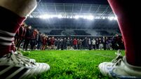 The Munster team and backroom staff sing ‘Stand up and Fight’ on the pitch after the game in tribute to Anthony Foley 17/10/2026