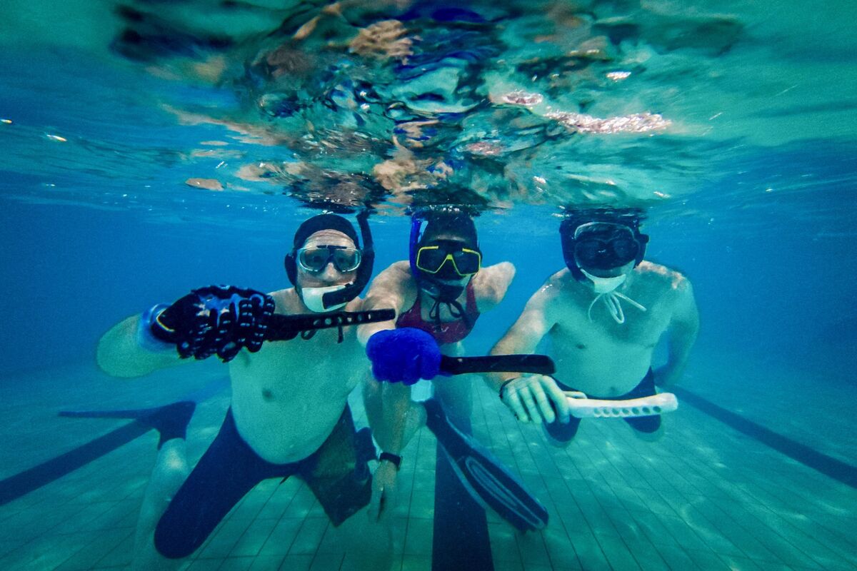 Members of Cork Underwater Hockey Club compete underwater during a training session, using the bottom of the pool as their playing surface. Picture: Chani Anderson Members of Cork Underwater Hockey Club compete underwater during a training session, using the bottom of the pool as their playing surface. Picture: Chani Anderson