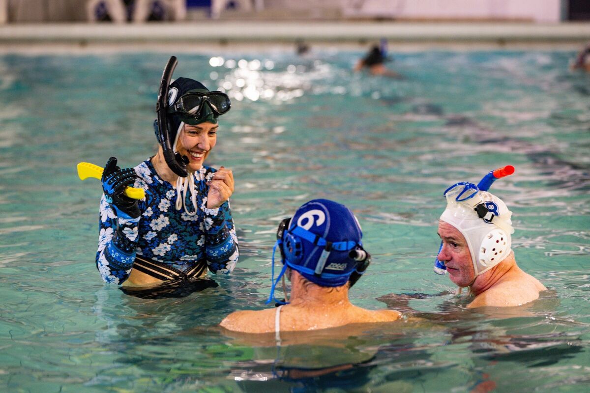 Barry Murray demonstrates the basics of underwater hockey to a beginner during a Cork Underwater Hockey Club training session. Picture: Chani Anderson Barry Murray demonstrates the basics of underwater hockey to a beginner during a Cork Underwater Hockey Club training session. Picture: Chani Anderson