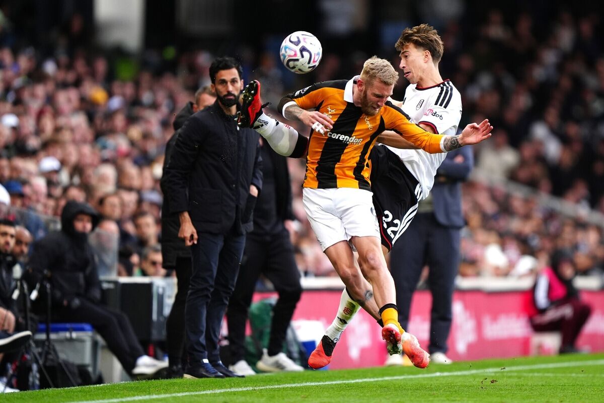 Fulham manager Alvaro Arbeloa (left) looks on as Hull City's Oliver McBurnie and Fulham's David Affengruber battle for the ball. Pic: Bradley Collyer/the Press Association.