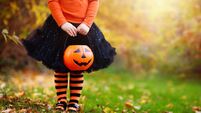 Little girl having fun on Halloween trick or treat