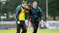 Lee Keegan is helped from the field by selector Tony McEntee and Dr. Sean Moffatt 31/1/2016