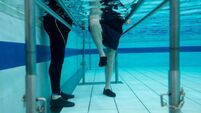 Senior man doing physical therapy in the water