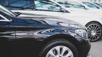 Cars in a row at a car dealer, new cars and used cars