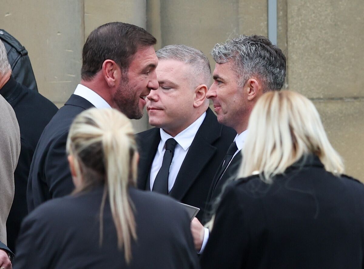 Former boxer Alex Arthur (left) and actor Paul Brannigan (right) depart the funeral of Paul Ferris at Daldowie Crematorium in Glasgow. Picture: Robert Perry/the Press Association