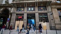 Milan shopfronts boarded up after weekend protest clashes