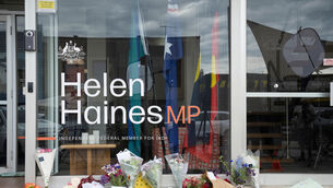 Tributes and flowers are placed outside the electoral office for independent member of parliament Helen Haines in Wangaratta (James Ross/AAPImage via AP/PA) Tributes and flowers are placed outside the electoral office for independent member of parliament Helen Haines in Wangaratta (James Ross/AAPImage via AP/PA)