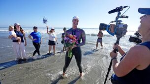 <p>WATER CREATURE: 33 year old Catherine Breed reaches the beach at Coronado, California after swimming from Brookings, Oregon, to the Mexico border, taking 111 days. Pic: Nelvin C. Cepeda/The San Diego Union-Tribune</p>