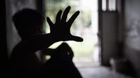 Child abuse concept, silhouette of  child confined in a dark room, prisoner or child abduction, child abuse human trafficking.