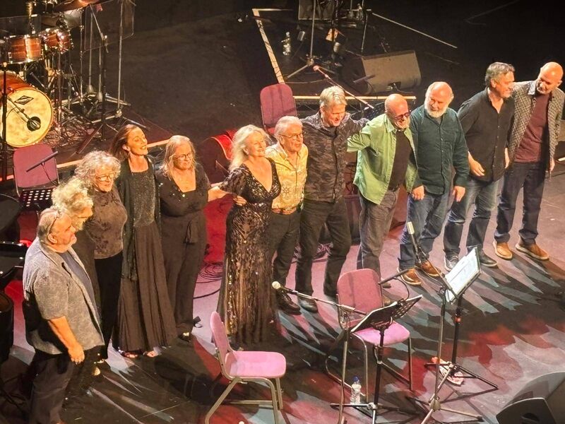 Jimmy MacCarthy (centre, with yellow shirt) and his ensemble take their bows at Cork Opera House. 