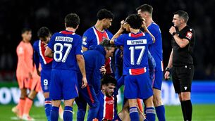 <p>PSG's Khvicha Kvaratskhelia (C) is assisted after an injury. Pic: JULIEN DE ROSA / AFP via Getty Images</p> <p>PSG's Khvicha Kvaratskhelia (C) is assisted after an injury. Pic: JULIEN DE ROSA / AFP via Getty Images</p>