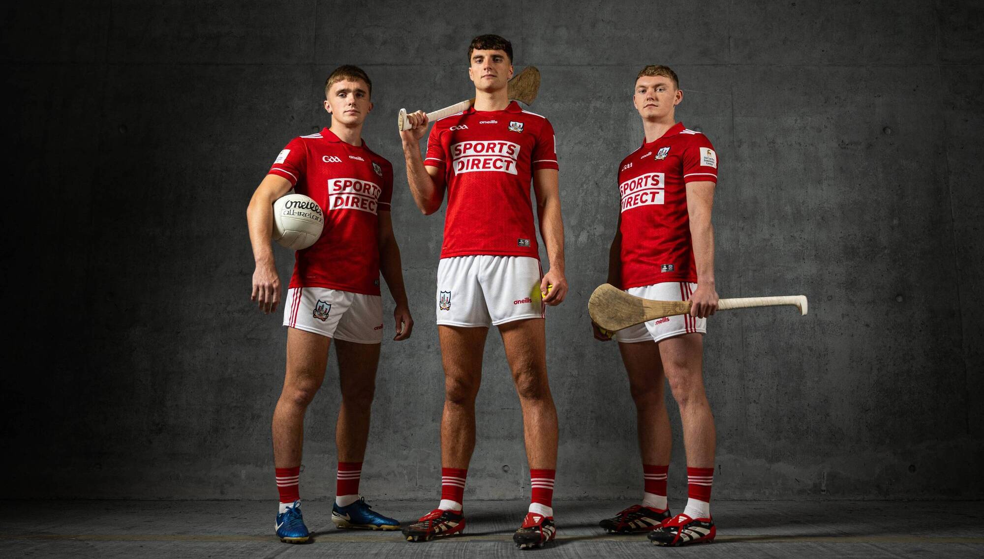 Cork footballer Tommy Walsh (left) and hurlers Brian Hayes and Shane Barrett model the new Cork jersey, which will be worn from 2027. 